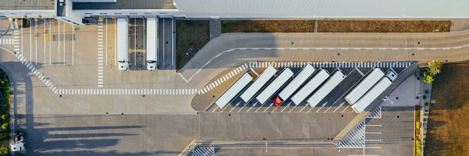 Commercial freight vehicles at a logistics distribution depot