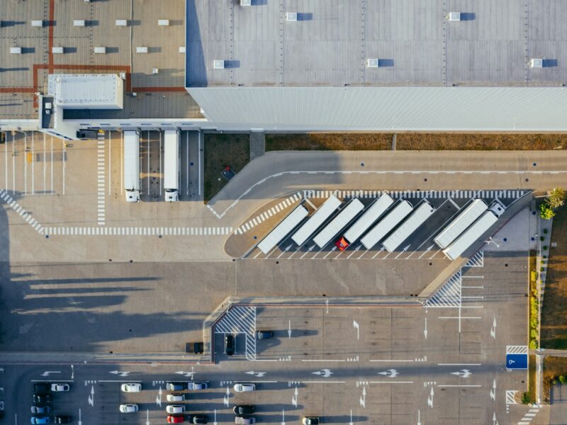 Commercial freight vehicles at a logistics distribution depot